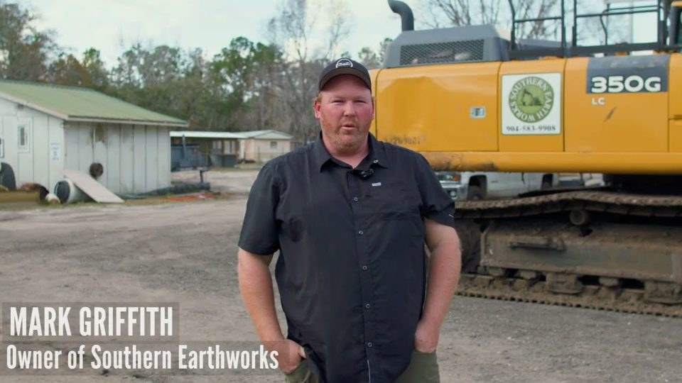Southern Earthworks owner Mark Griffith interviewed in front of an excavator
