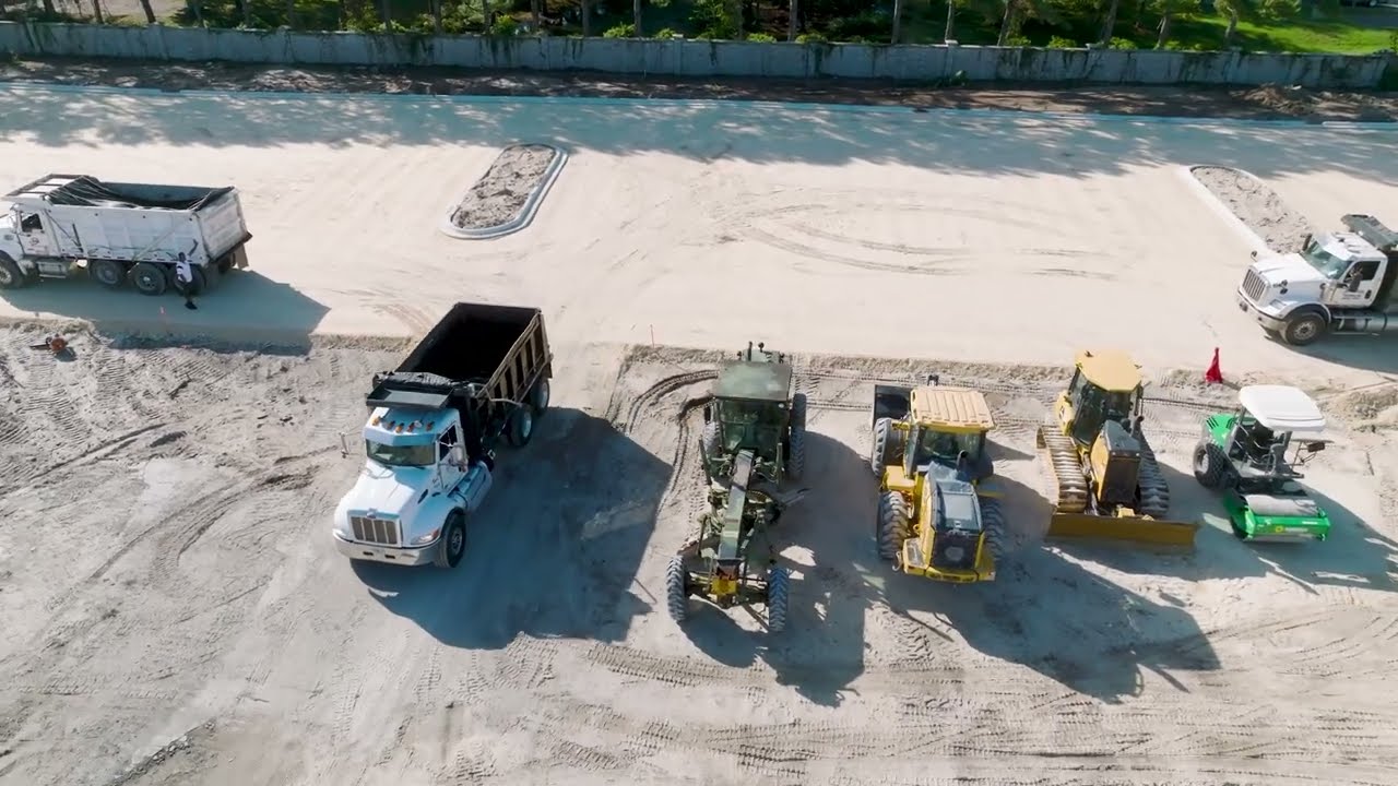 Aerial view of a Southern Earthworks fleet lined up on a large site